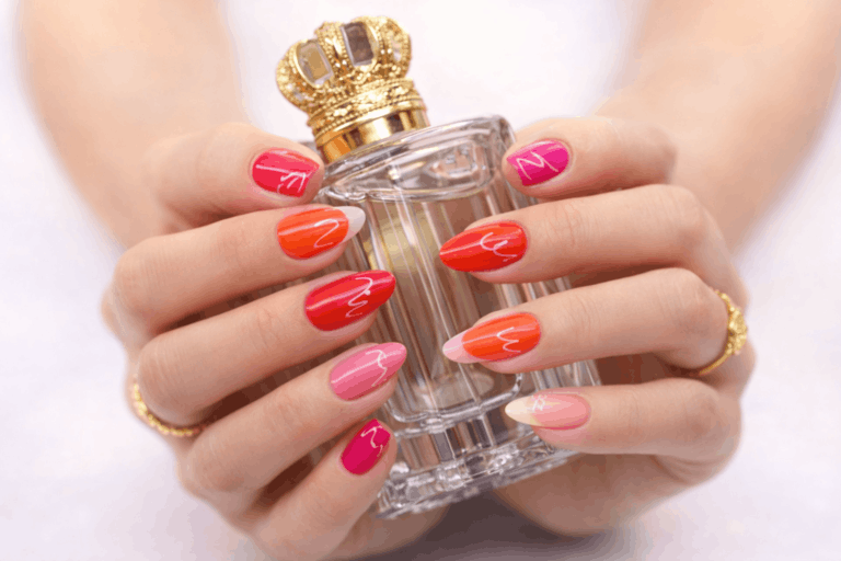 girl holding perfume bottle showing her nails
